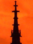 steeple great tower black silhouette at red and orange backgrounf