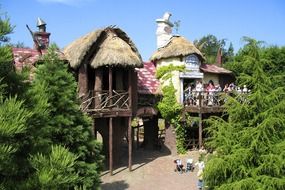 theme park entertainment with thatched roof