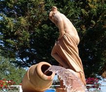 woman with a jug like a fountain in the mediterranean