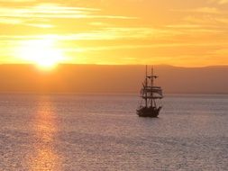 sailboat on the sea during sunset