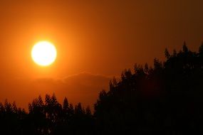bright sun at sunset in autumn