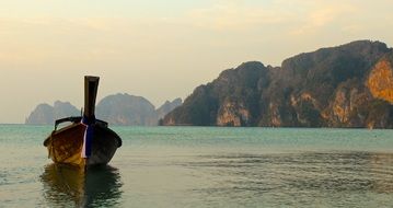 traditional boat among picturesque landscape in thailand