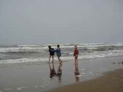children indulge in the evening beach