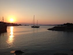boat in the harbor at sunset