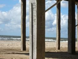 wooden beams on the beach in denmark