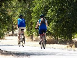 two cyclists travel outside the city