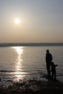 father and son at the lake