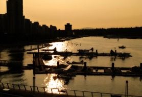 panorama of a small harbor at sunset