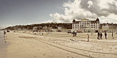 people on beach at sea, france, trouville