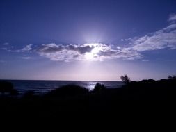 Sunrise on a cloudy sky over the beach