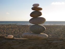 balanced stone pyramid on the beach