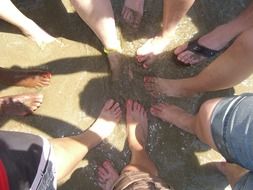 team feet in water