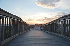 wooden bridge beach evening