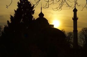 sunset on the background of the mosque