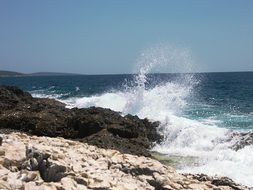 splashes of the Adriatic Sea on the coast in Croatia