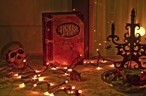 hocus pocus book and halloween decorations, still life