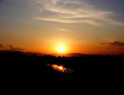 Fiery sunset against nature background