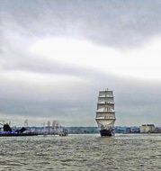 sailing boat during the wind on the river