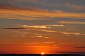 orange sunset in the clouds on the horizon