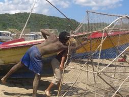 fisherman near a boat in jamaica