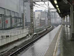 black and white photo of the railway at the station