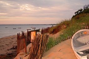 Boats on a sand sunset