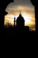 Silhouette of the dome of the mosque at dusk