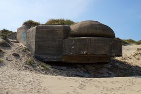 brown bunker in sand france normandy