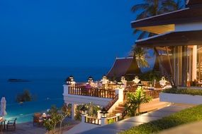 hotel on tropical sea coast at dusk