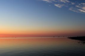 red stripe of sunset afterglow above sea at evening sky, germany, fÃ¶hr