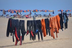 hanging surf clothing on the beach
