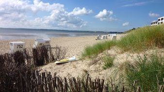 sand dunes and sun beds on the beach of the North Sea