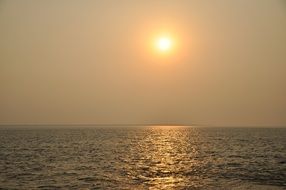 sunset over the calm ocean