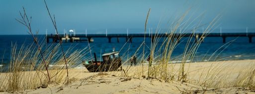 fishing boat on the beach of the Baltic Sea on a sunny day