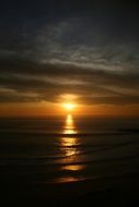 golden sunset light above the horizon