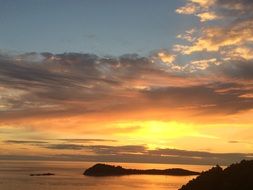 silhouettes of Islands in the sunset