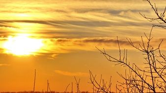 yellow sun in a haze of clouds