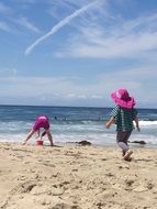 girls playing on the beach