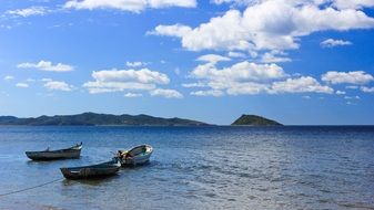 wooden boats on a blue ocean