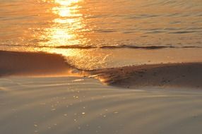 waves of the baltic sea in the bright rays of sunset