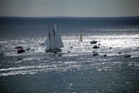 ship on sea water near stones