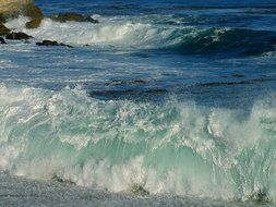 Waves in water close-up on a sunny day