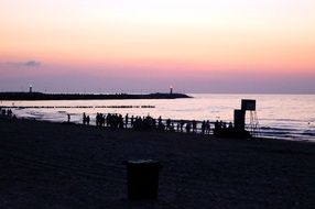 Beautiful colorful beach with the silhouettes