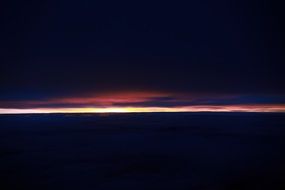 strip of sunset in the dark sky