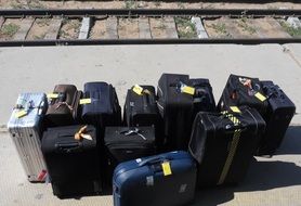 suitcases with tags on the station platform