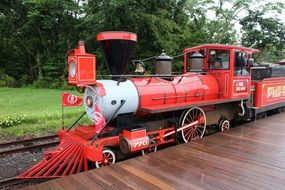 very beautiful red antique train on a railway