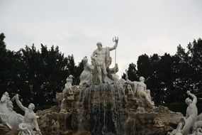 sculpture of zeus on a large fountain