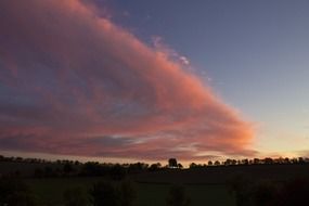 pink cloud in evening twilight scene