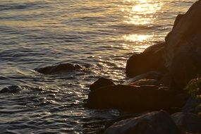 stones near the lake at dusk