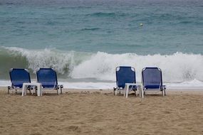 blue beach chairs on the beach